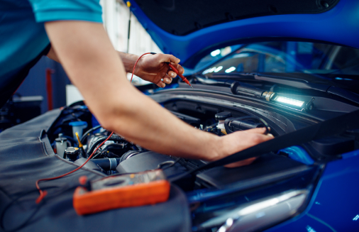 Auto electrician checks electrical circuits